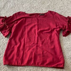 Red ruffled blouse with flutter sleeves and short sleeves